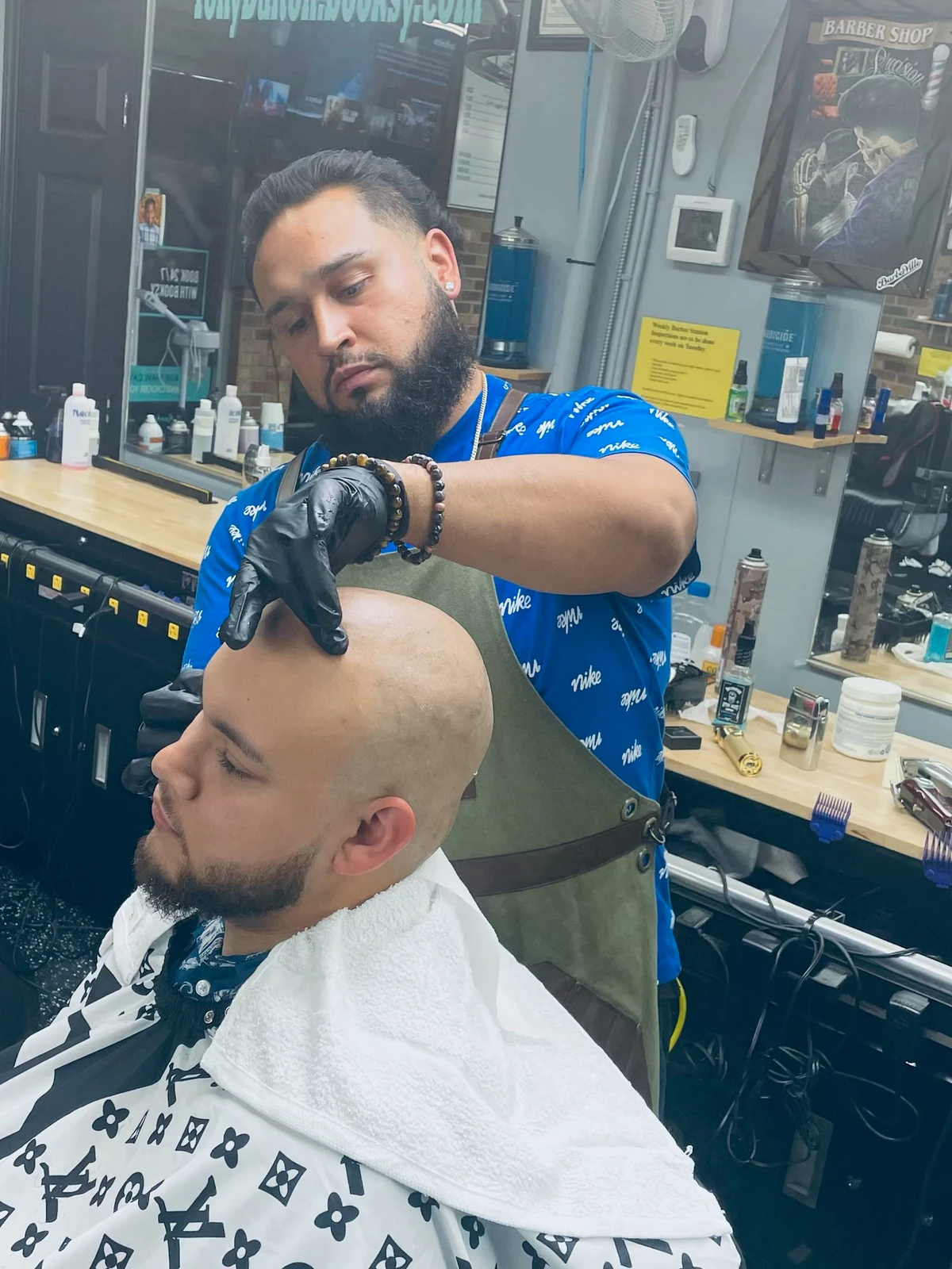 Carlos Ontiveros at work in the barbershop